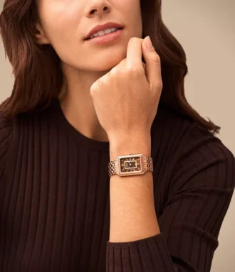Reloj Raquel de acero inoxidable tono oro rosa con tres agujas y fecha